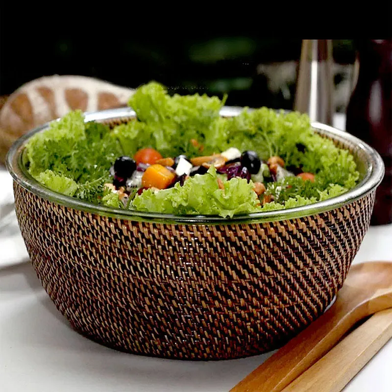 Glass salad bowl with woven rattan holder